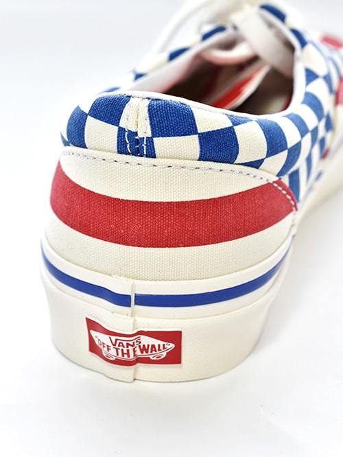 Checkered vans hotsell with red stripe