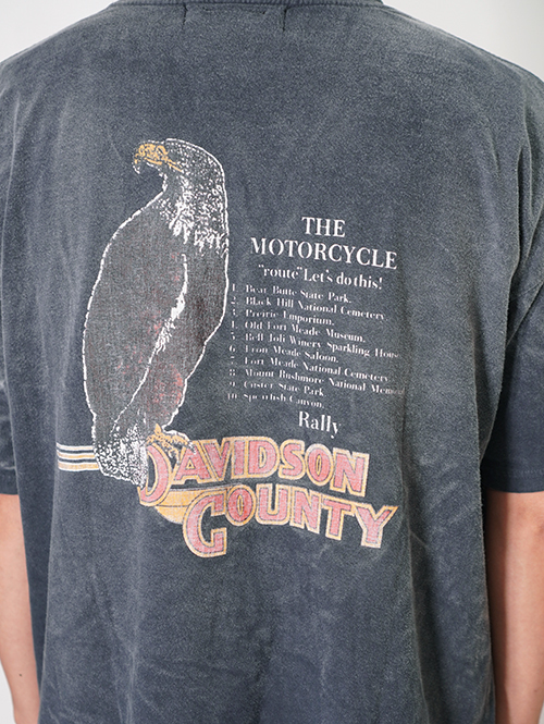 REMI RELIEF  NEW SP加⼯20/天竺BIGサイズ T（North Carolina Rally)  - Vintage Black